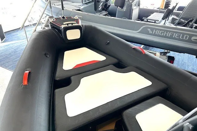 Slide: The Image of 2026 Highfield Velox 560 inflatable boat interior with cushioned seating. - 9