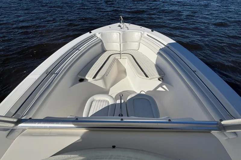 Slide: The Image of 2012 Sea Fox 256 Center Console boat on water, featuring spacious seating and sleek design. - 9