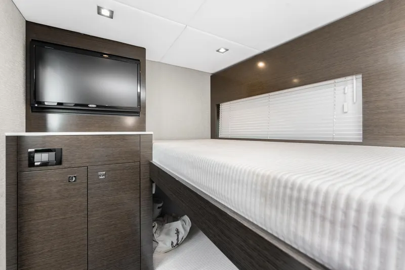 Slide: The Image of Interior cabin of 2018 Cruisers Yachts 50 Cantius with TV and bed. - 18
