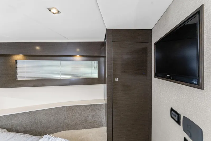 Slide: The Image of Interior of 2018 Cruisers Yachts 50 Cantius with modern design and wall-mounted TV. - 26