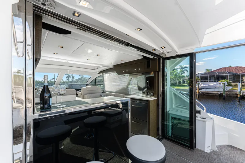 Slide: The Image of Luxurious 2018 Cruisers Yachts 50 Cantius interior with modern kitchen and seating area. - 49