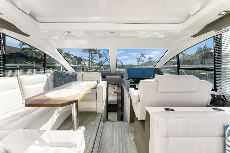 Slide: The Image of Luxurious interior of 2018 Cruisers Yachts 50 Cantius with modern seating and panoramic windows. - 35