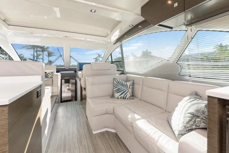 Slide: The Image of Luxurious interior of 2018 Cruisers Yachts 50 Cantius with modern seating and large windows. - 34