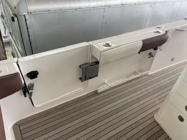 Slide: The Image of 2014 Everglades 325 Center Console boat interior with sleek deck and seating. - 21