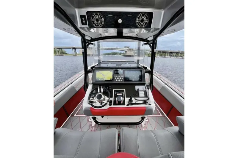 Slide: The Image of 2022 Fountain 38 SC boat cockpit with advanced navigation system and sleek design. - 7