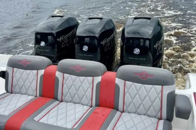 Slide: The Image of 2022 Fountain 38 SC boat with triple outboard engines and stylish seating. - 9