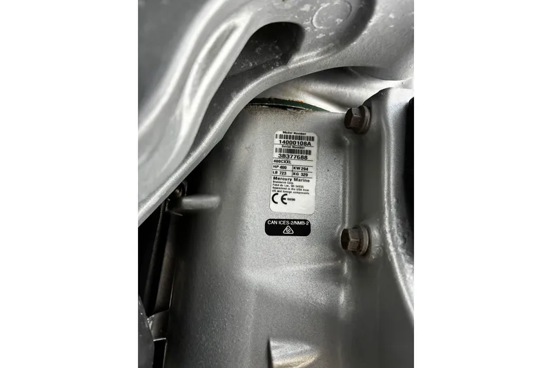 Slide: The Image of Close-up of a 2024 Caymas 401 CC engine label with specifications. - 6