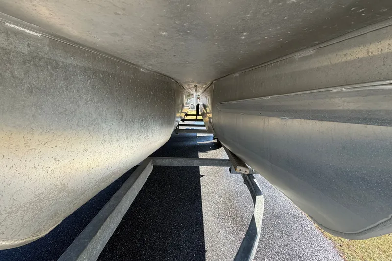 Slide: The Image of Underneath view of a 2020 SunCatcher V322C pontoon boat on a trailer. - 7