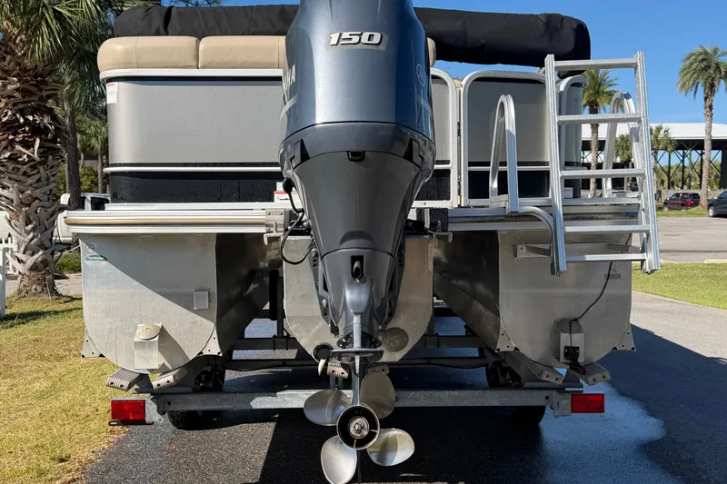 Slide: The Image of 2020 SunCatcher V322C pontoon boat with Yamaha 150 engine, parked outdoors. - 4
