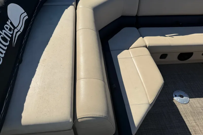 Slide: The Image of SunCatcher V322C 2020 boat interior with beige seating and flooring. - 20