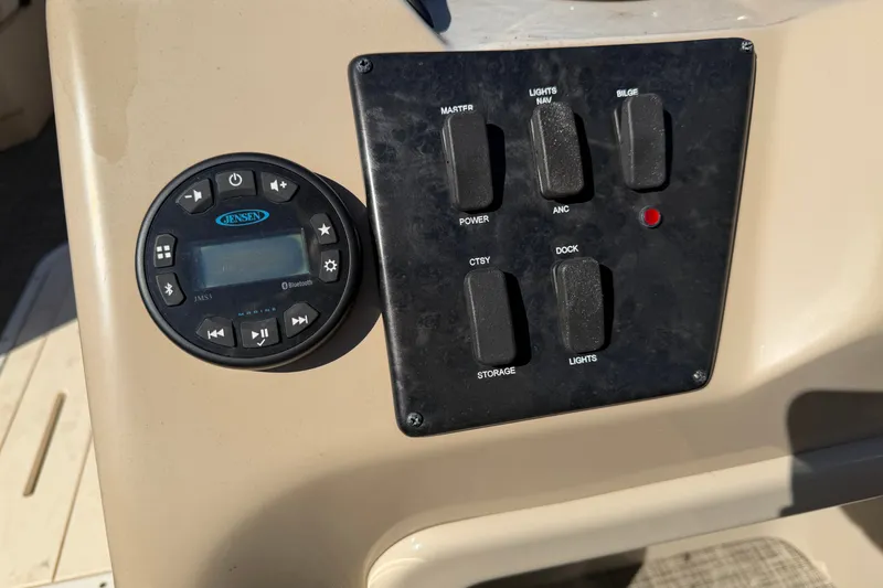 Slide: The Image of Control panel of a 2020 SunCatcher V322C boat with Jensen audio system. - 14