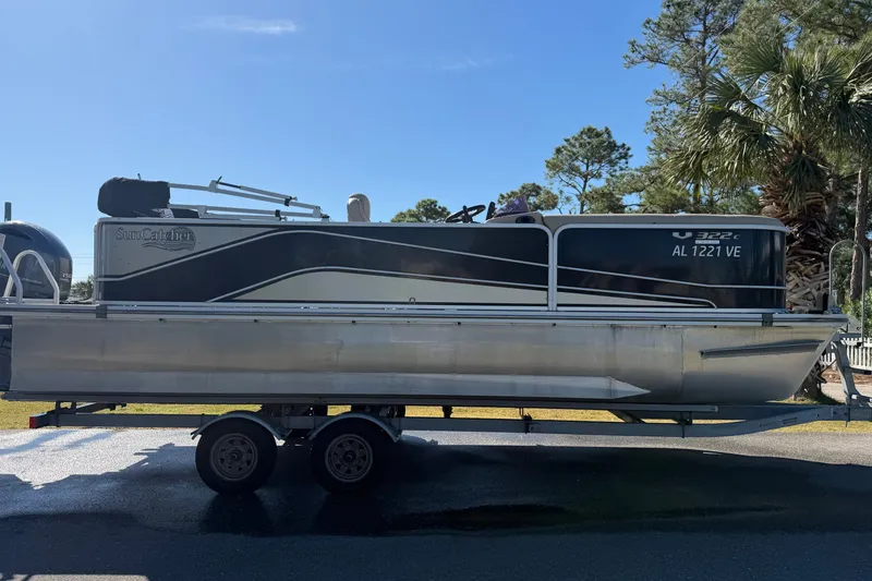 Slide: The Image of 2020 SunCatcher V322C pontoon boat on trailer, parked outdoors. - 5