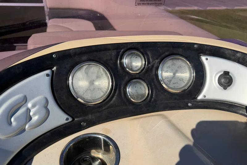 Slide: The Image of Dashboard of a 2020 SunCatcher V322C boat with gauges and controls. - 15