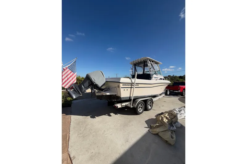 Slide: The Image of 2003 Grady-White Gulfstream 232 boat on trailer, clear sky background. - 8