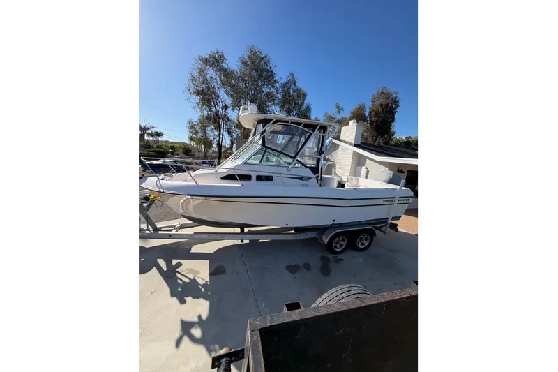 Slide: The Image of 2003 Grady-White Gulfstream 232 boat on trailer, parked outdoors. - 7