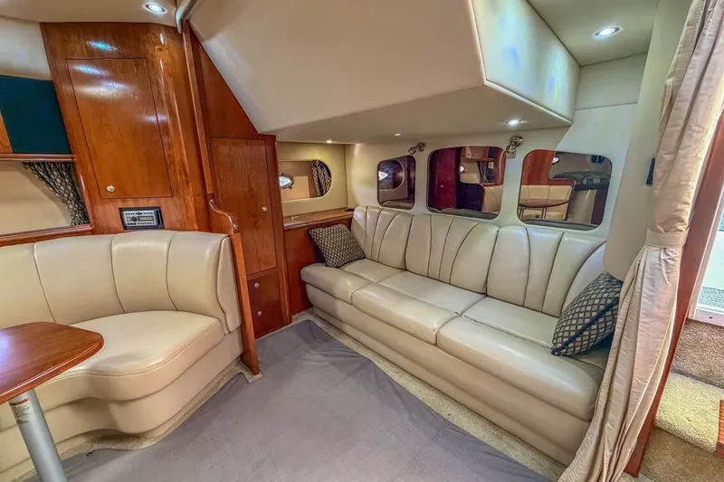 Slide: The Image of Luxurious interior of 2005 Cruisers Yachts 370 Express with leather seating and wood accents. - 15