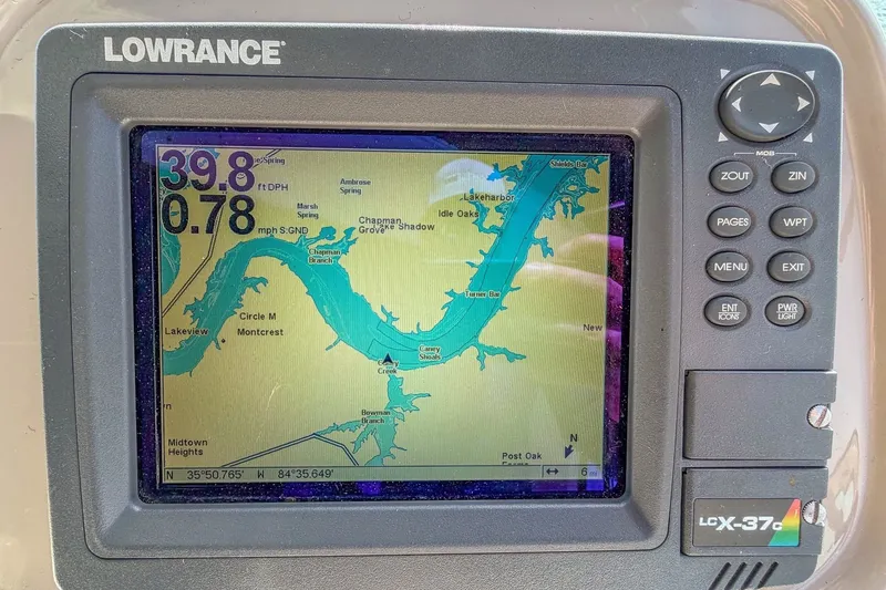 Slide: The Image of Lowrance GPS display on 2005 Cruisers Yachts 370 Express, showing navigation map and data. - 23