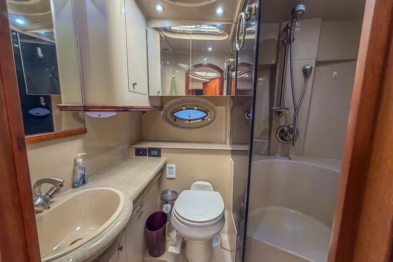 Slide: The Image of Luxurious bathroom in 2005 Cruisers Yachts 370 Express with modern fixtures and shower. - 13