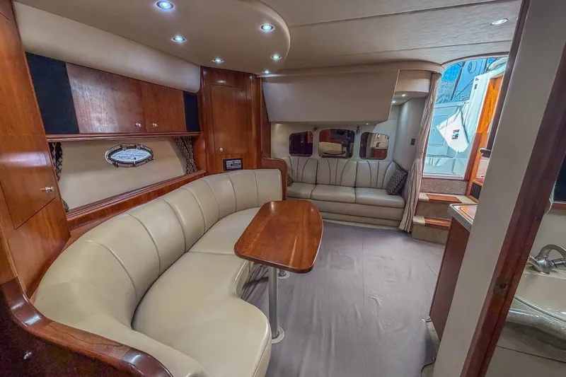 Slide: The Image of Luxurious interior of 2005 Cruisers Yachts 370 Express with elegant seating and wood finishes. - 14