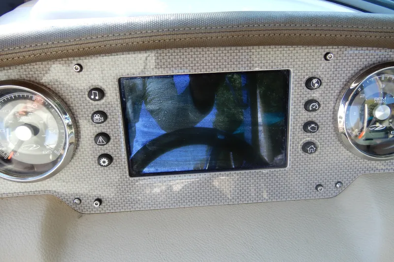 Slide: The Image of Dashboard of a 2013 Regal 24 FasDeck boat with gauges and control panel. - 12