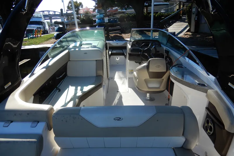 Slide: The Image of Interior view of 2013 Regal 24 FasDeck boat with seating and steering area. - 4