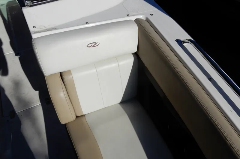 Slide: The Image of 2013 Regal 24 FasDeck boat seat with beige and white upholstery. - 17