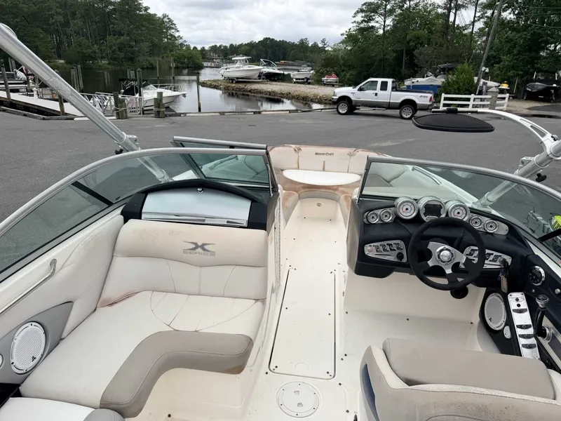 Slide: The Image of The image shows the cockpit of a 2008 MasterCraft X-45 boat with sleek seating and controls. - 3