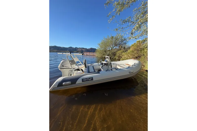 The Image of Tide Craft Coronado 14 boat by the lake, 2027 model, sunny day. - 0