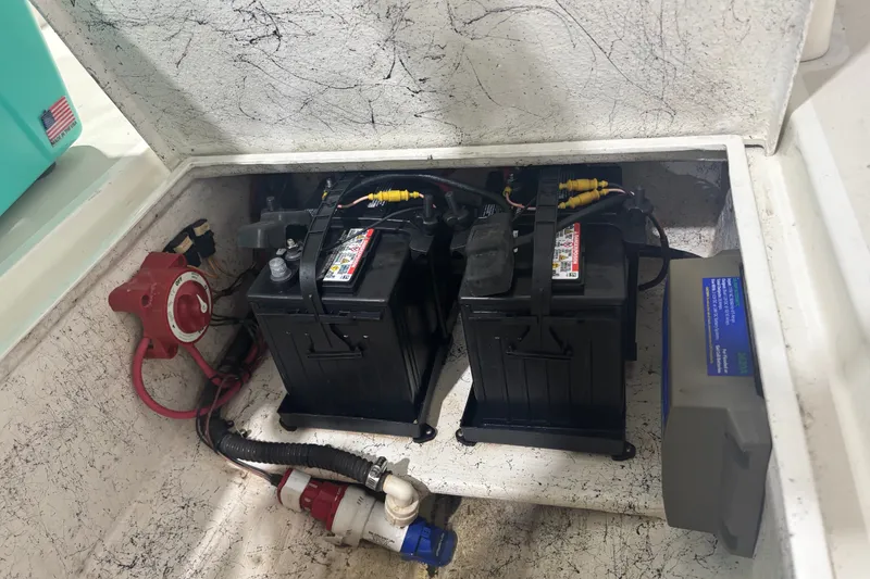 Slide: The Image of Battery compartment of a 1982 Shamrock 170 Center Console boat with dual batteries. - 7