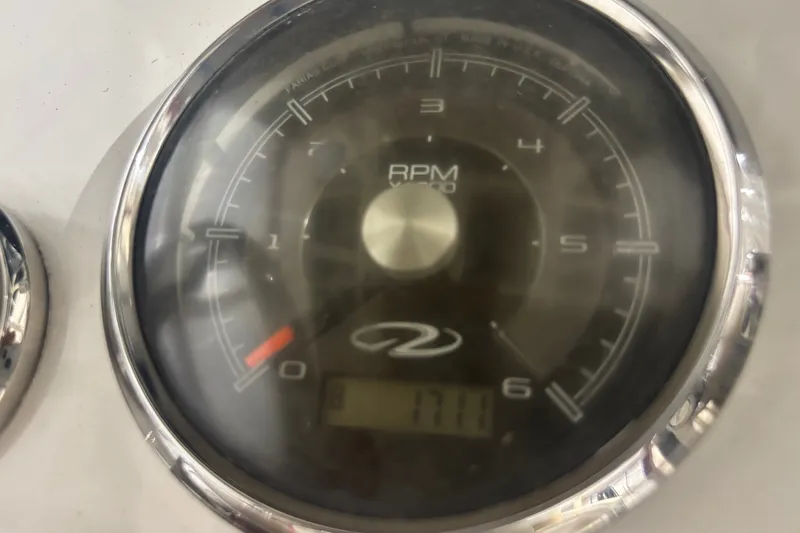 Slide: The Image of Close-up of a 1982 Shamrock 170 Center Console RPM gauge displaying 1711 RPM. - 4