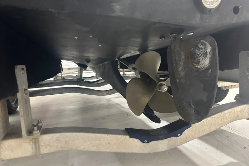 Slide: The Image of Underside view of a 1982 Shamrock 200 Open boat on a trailer. - 11