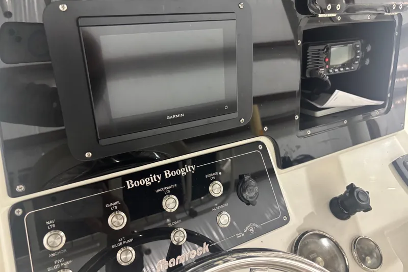 Slide: The Image of Control panel of a 1982 Shamrock 200 Open boat with Garmin display. - 13