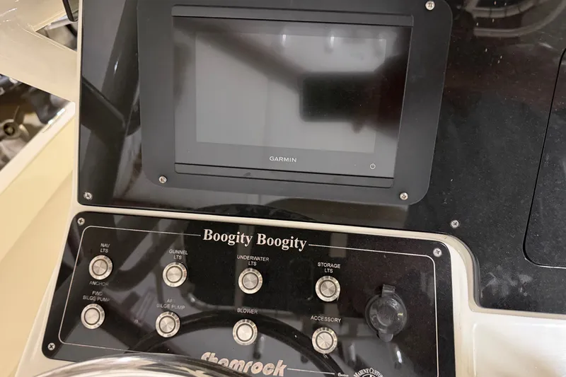 Slide: The Image of Control panel of a 1982 Shamrock 200 Open boat with Garmin display. - 18