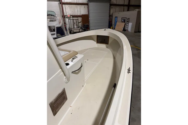 Slide: The Image of 1982 Shamrock 200 Open boat interior in a warehouse setting. - 21