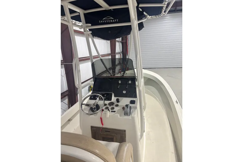 Slide: The Image of 1982 Shamrock 200 Open boat interior with steering console and canopy. - 7
