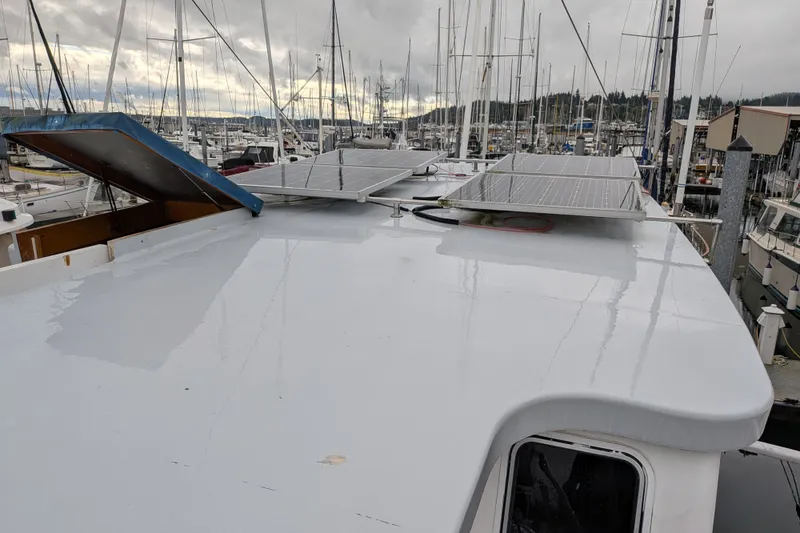 Slide: The Image of Custom 1981 Pilothouse Trawler with solar panels on deck, docked in marina. - 19