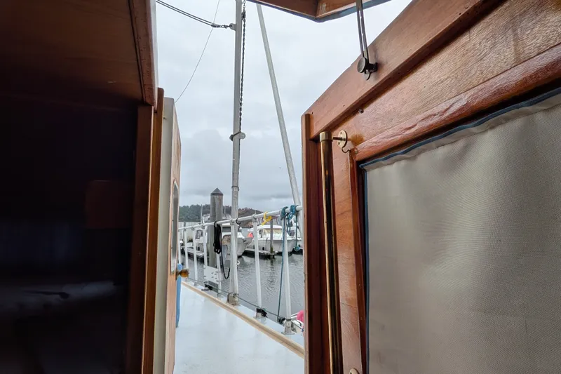 Slide: The Image of View from inside a 1981 Custom 43 Pilothouse Trawler, looking out to a marina. - 15