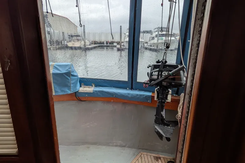 Slide: The Image of Interior view of 1981 Custom 43 Pilothouse Trawler with marina in background. - 37