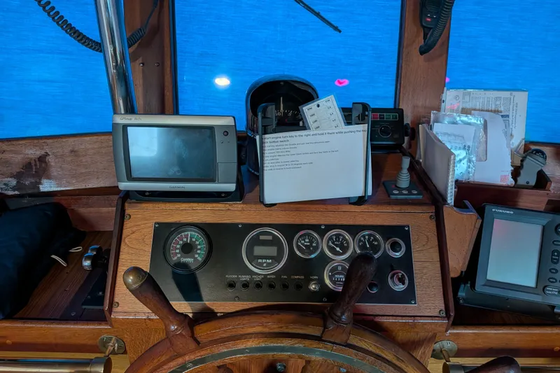 Slide: The Image of Pilothouse dashboard of 1981 Custom 43 Pilothouse Trawler with navigation equipment and controls. - 59