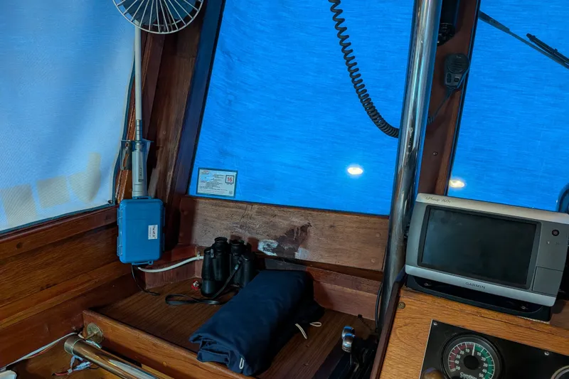 Slide: The Image of Interior of 1981 Custom 43 Pilothouse Trawler with navigation equipment and binoculars. - 60