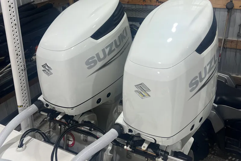 Slide: The Image of Twin Suzuki outboard motors on a 2023 SeaHunter 28 Floridian boat. - 42