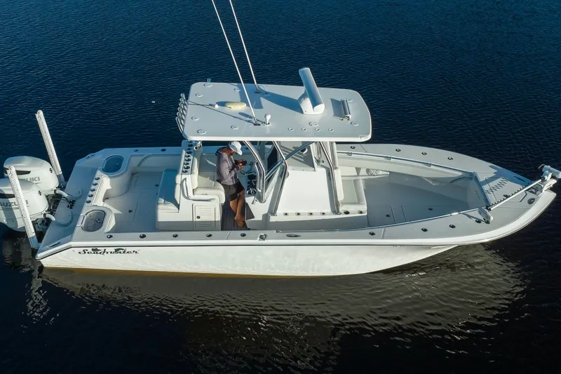 Slide: The Image of 2023 SeaHunter 28 Floridian boat on calm water, featuring sleek design and modern amenities. - 17