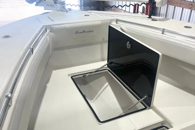 Slide: The Image of 2023 SeaHunter 28 Floridian boat interior with open storage compartment. - 41