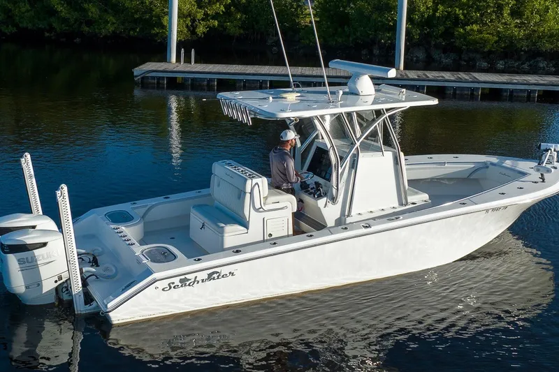 Slide: The Image of 2023 SeaHunter 28 Floridian boat on calm water, featuring sleek design and modern equipment. - 21