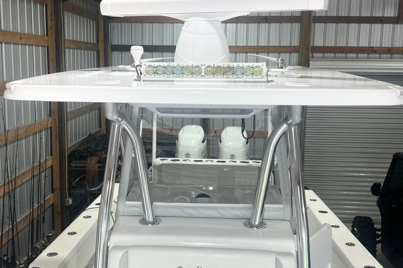 Slide: The Image of 2023 SeaHunter 28 Floridian boat with T-top and LED lights in a storage facility. - 43