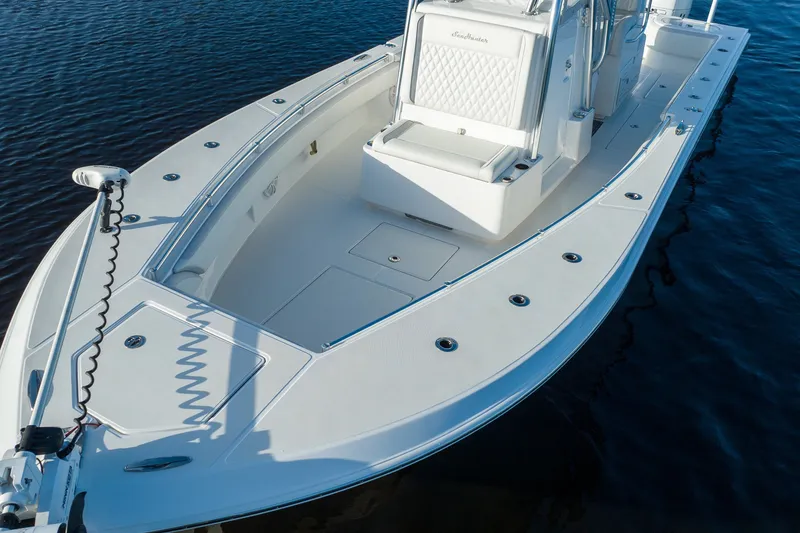 Slide: The Image of 2023 SeaHunter 28 Floridian boat on water, featuring sleek white deck design. - 32