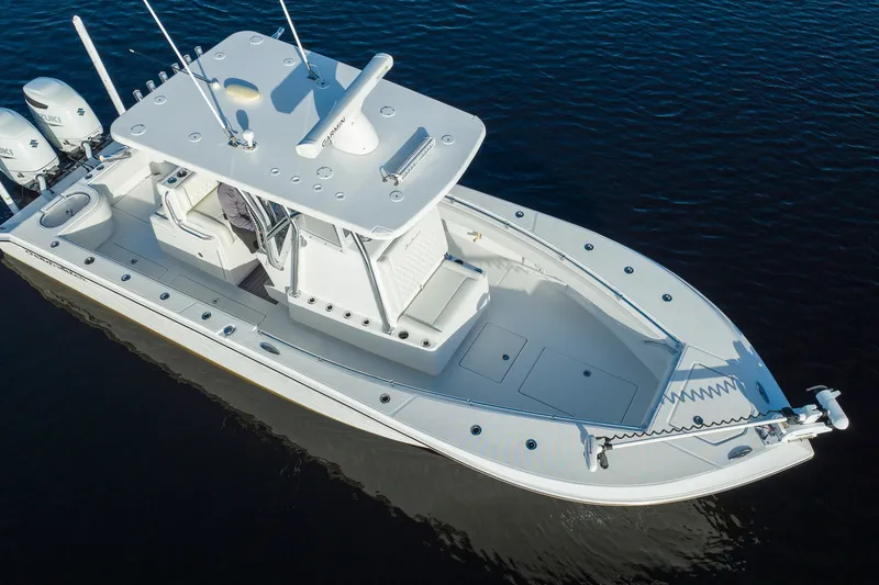 Slide: The Image of 2023 SeaHunter 28 Floridian boat on water, aerial view, showcasing sleek design and twin engines. - 27