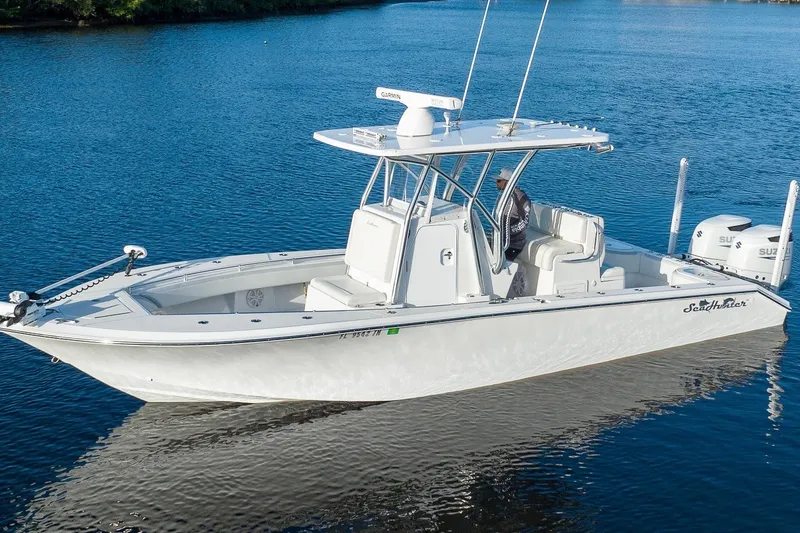 The Image of 2023 SeaHunter 28 Floridian boat on calm water, featuring sleek design and dual engines. - 0