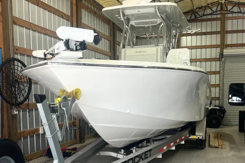 Slide: The Image of 2023 SeaHunter 28 Floridian boat on trailer in a storage facility. - 35