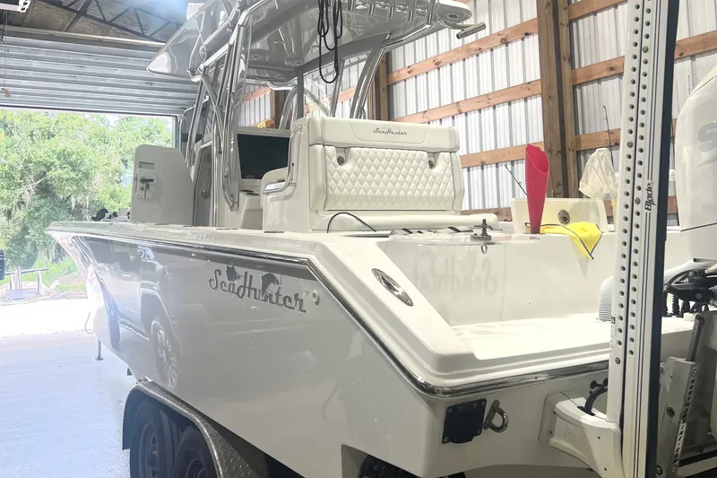 Slide: The Image of 2023 SeaHunter 28 Floridian boat in a garage, showcasing sleek design and modern features. - 36